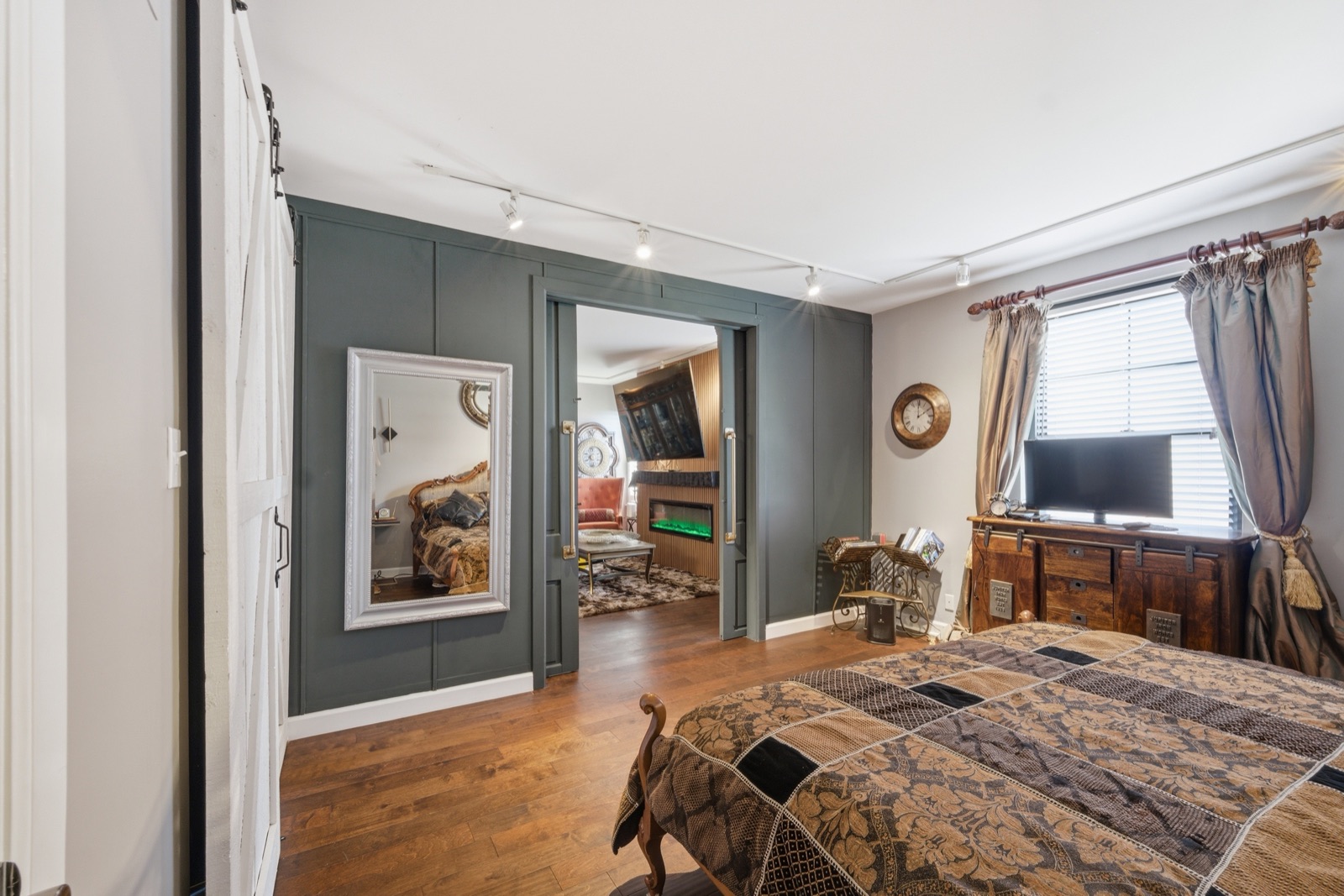 Bedroom sliding doors open to the living room
