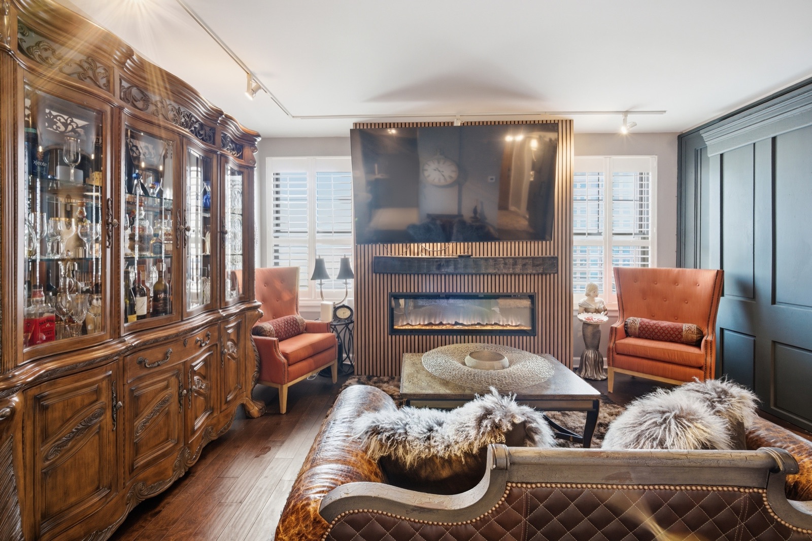 Living room with china cabinet and fireplace